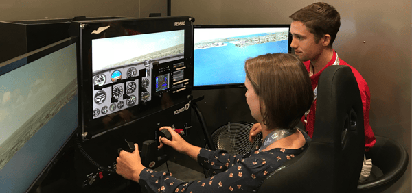 Pilot and Instructor Flying Redbird TD